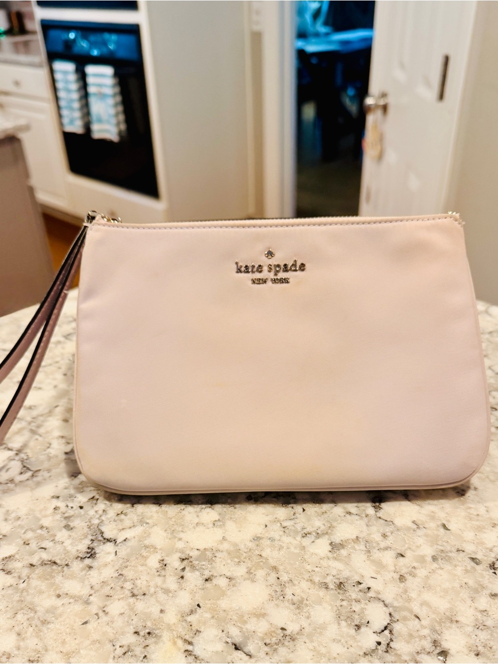 Kate Spade blush pink Wristlet with Gold Logo